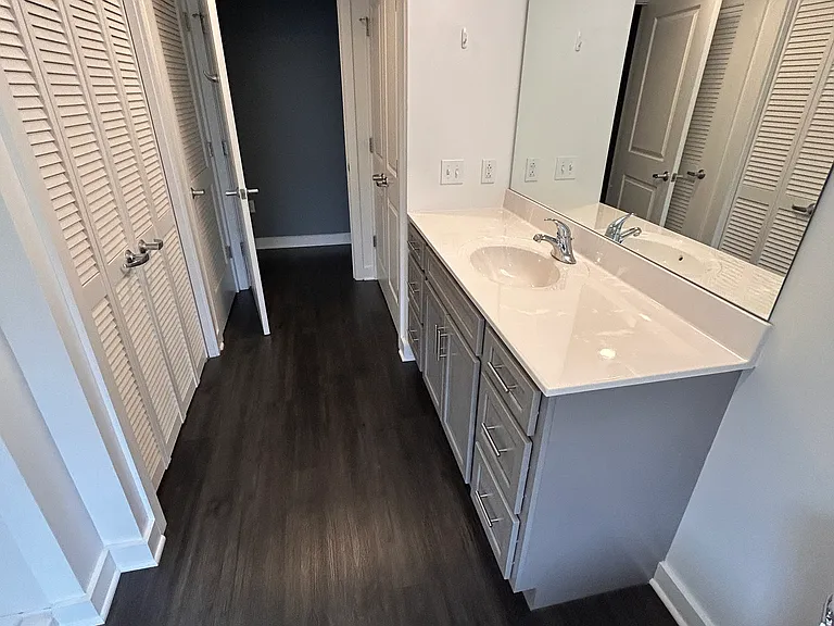 Bath Room vanity has full size granite counter top nd soft close drawers. Includes a spacious linen closet.