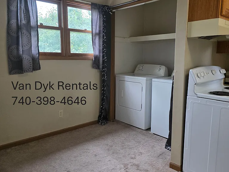 Dining area to the left of the laundry closet.