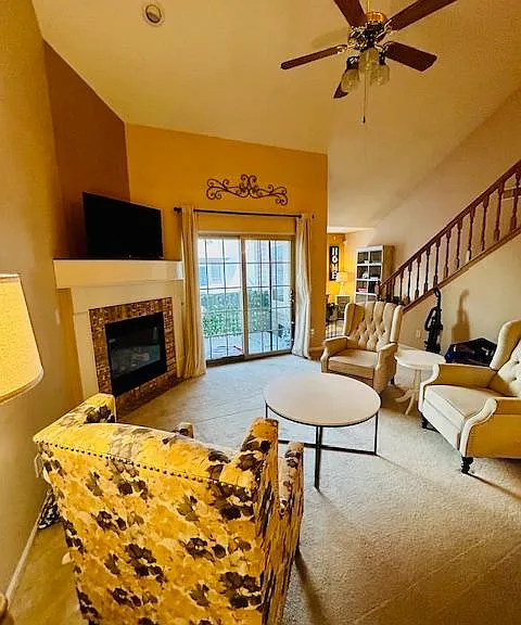 Living Space with tall 25 ft ceiling and gas fireplace