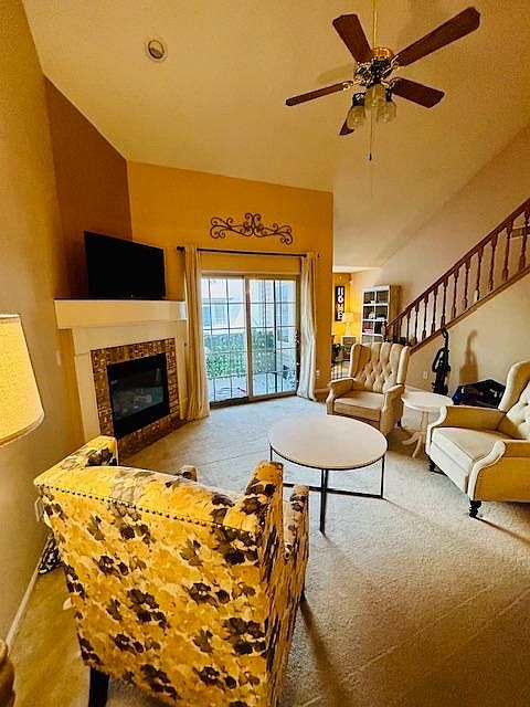 Living Space with tall 25 ft ceiling and gas fireplace