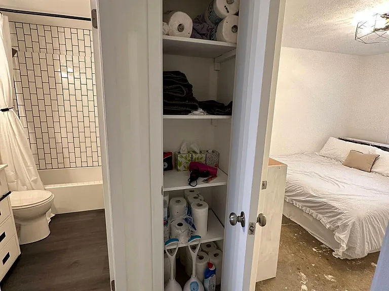 Guest bathroom, hallway linen closet, and guest bedroom.