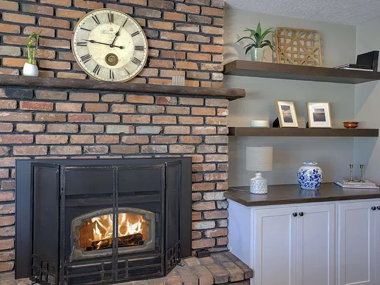 With a custom firewood box that is a pass through from the garage, the young ones never had it so easy with this firewood stocking chore :)
