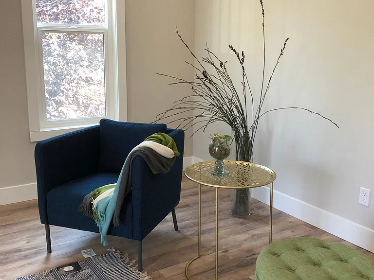 10 foot ceiling, spacious living room with ample natural light through two 5.5 foot tall windows. Wood laminate flooring in living room, both bedrooms, hall and sunroom. All newer textured walls, doors, dual pane windows. Decorator two tone paint.