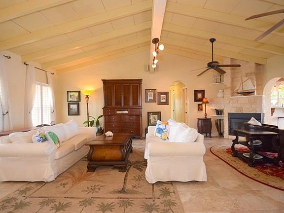 Open floor plan with vaulted ceilings and tongue and grove ceilings.