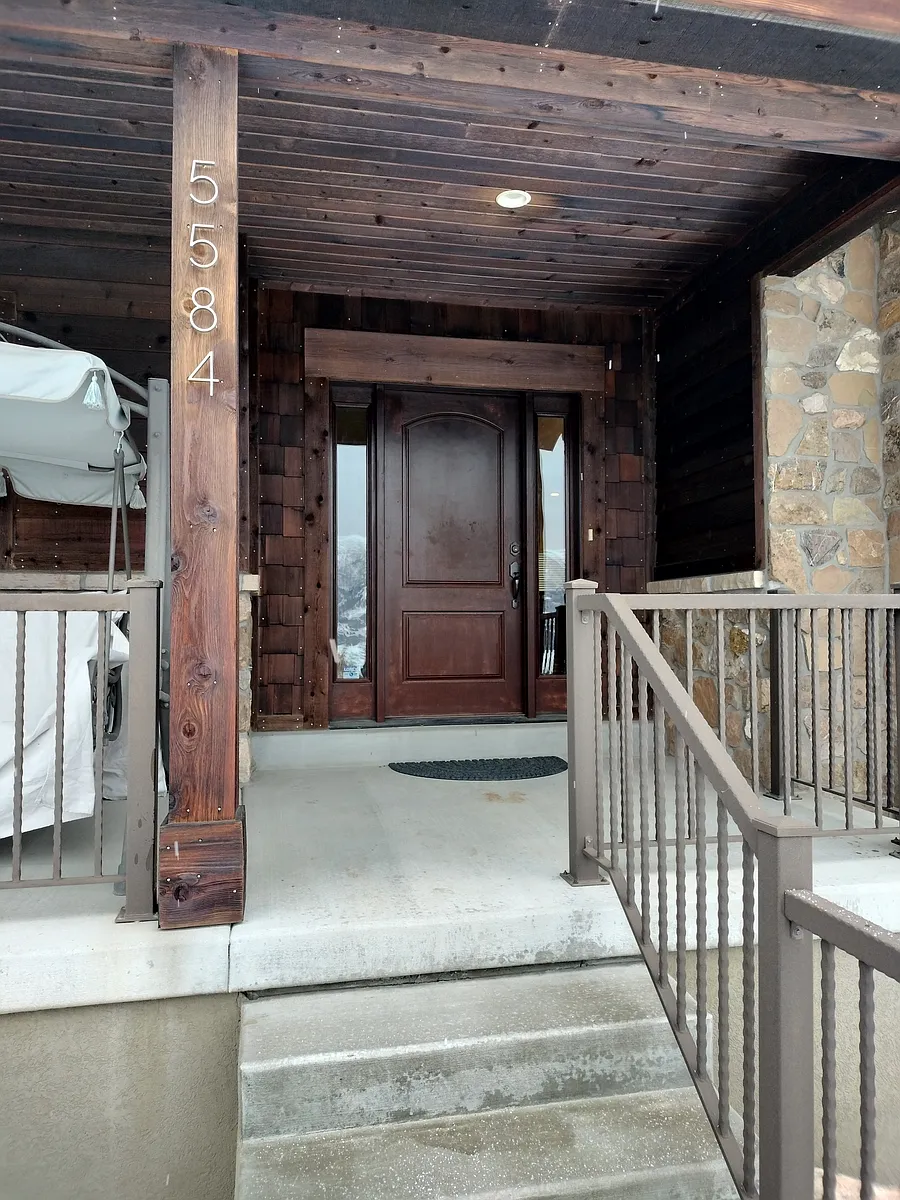 Spacious living room in a beautiful open-floor-plan home. Enjoy unobstructed mountain views, vibrant wildlife from your couch, and peace of mind with security cameras. Zero-scape yard ensures low maintenance and natural beauty year-round. - 5584 E Elkhorn Dr S