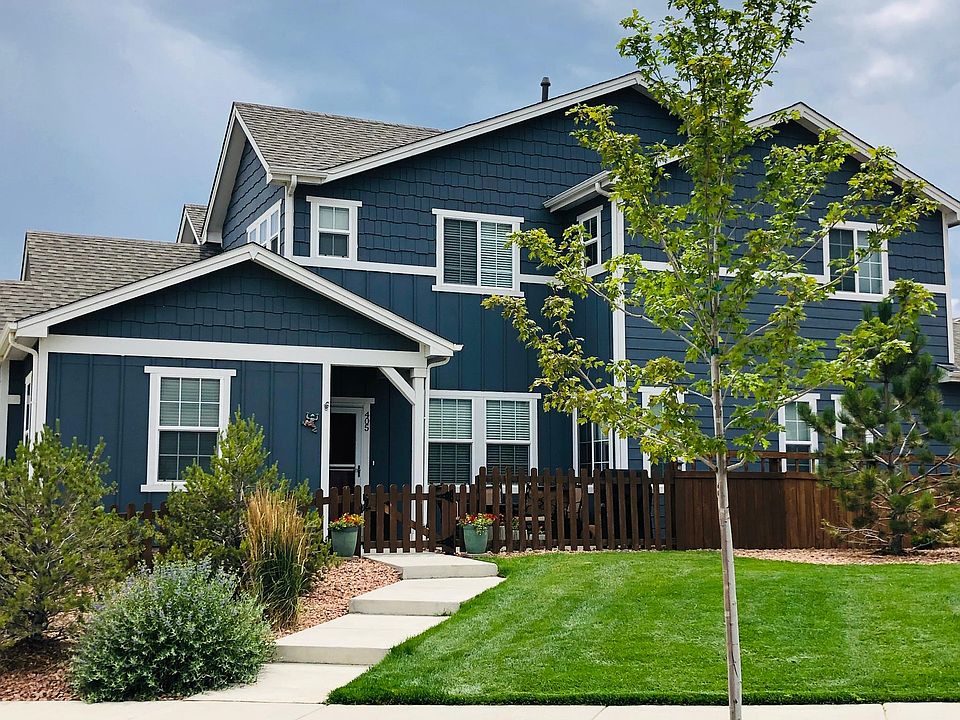 Front view with fenced patio area.