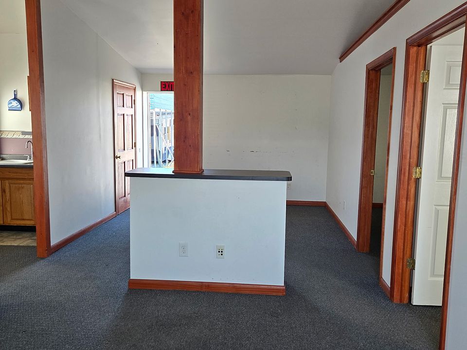 Rear exit door and back section of middle room