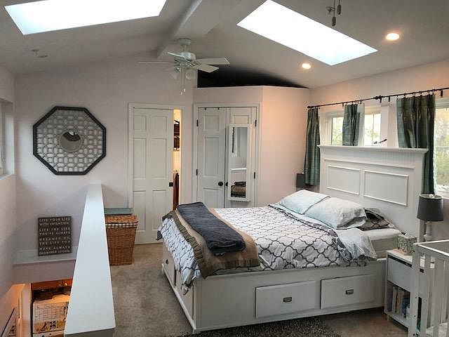 Upstairs bedroom with walk in closet and bathroom - as decorated by previous tenant.
