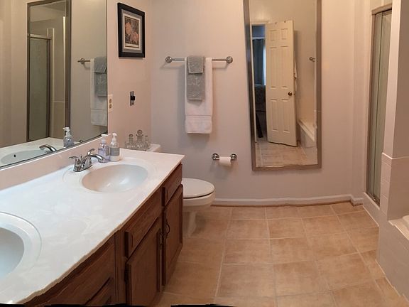 Master bathroom with dual his/her sinks, jacuzzi tub and sho