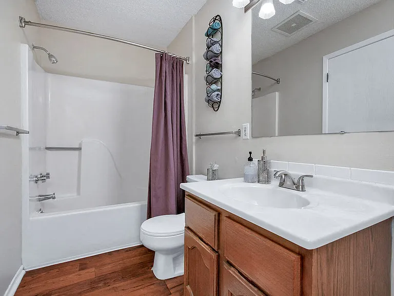 Well-Lit Vanities and Bowed Curtain Rods