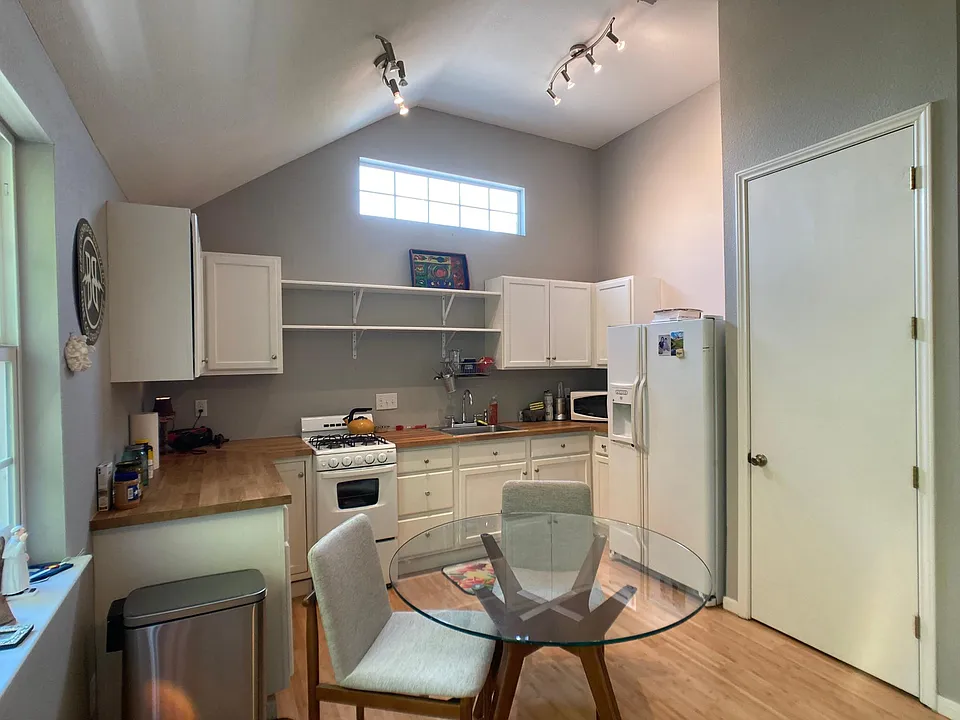 view from living area, door on right to laundry closet