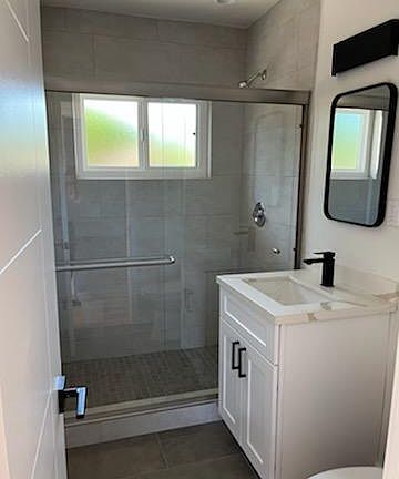 Updated glass shower enclosure, tile, countertops, sink faucet, etc.