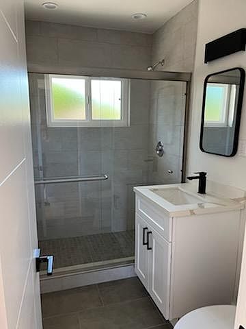 Updated glass shower enclosure, tile, countertops, sink faucet, etc.