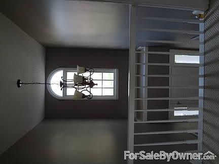Family Room
						:
						Light-filled family room with gas fireplace, hardwood floor.
