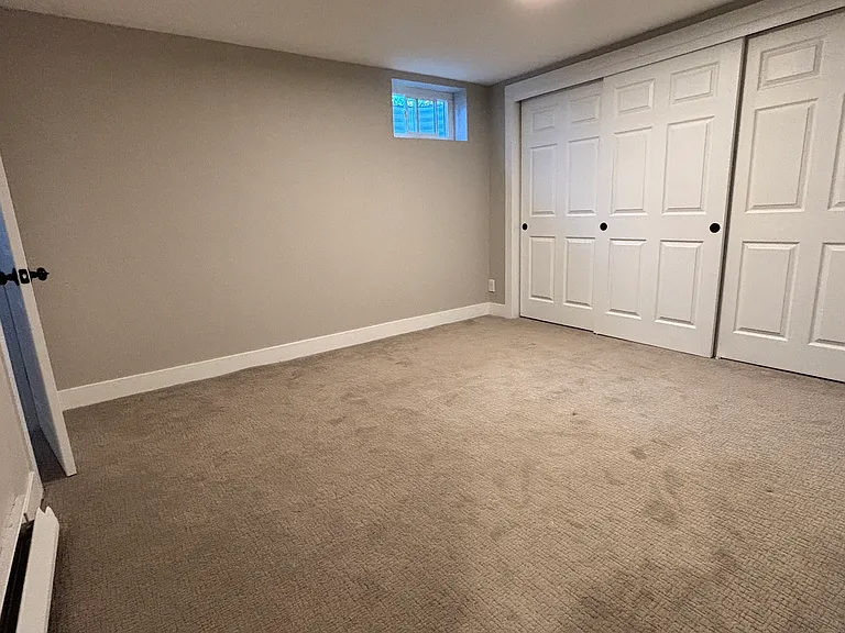 Second bedroom or office space. Spacious area with wall-to-wall closet.