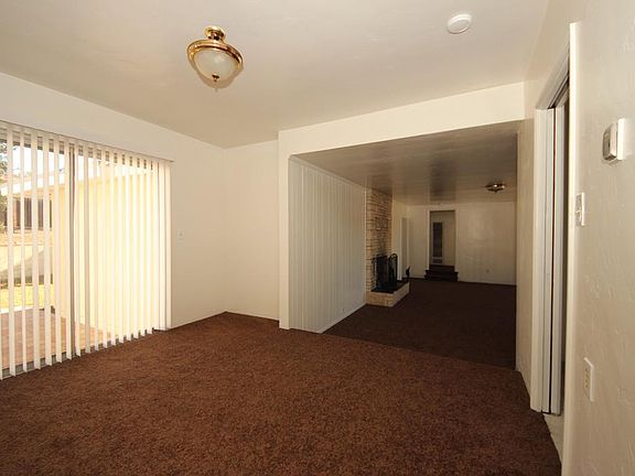 Formal dining area leads to back patio/yard