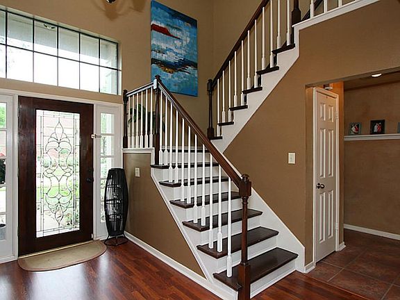 Enter into the home through a leaded glass front door - notice the two story entry. Home offers wood