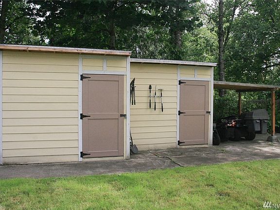 Large shop and covered area to store your tools and mowers. 