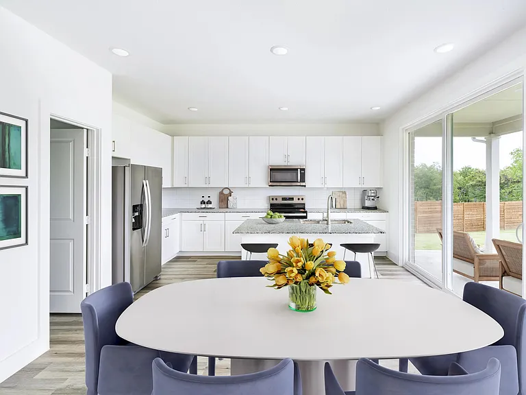 Sleek finishes and spacious design define this Amavi Celina kitchen, opening effortlessly to a large patio ideal for outdoor dining and gatherings.