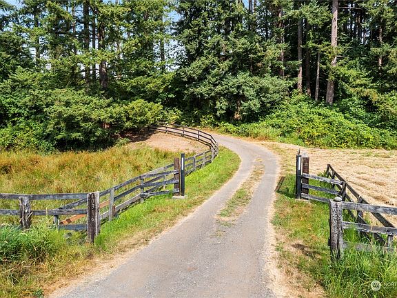 Private, gated drive meanders to home>