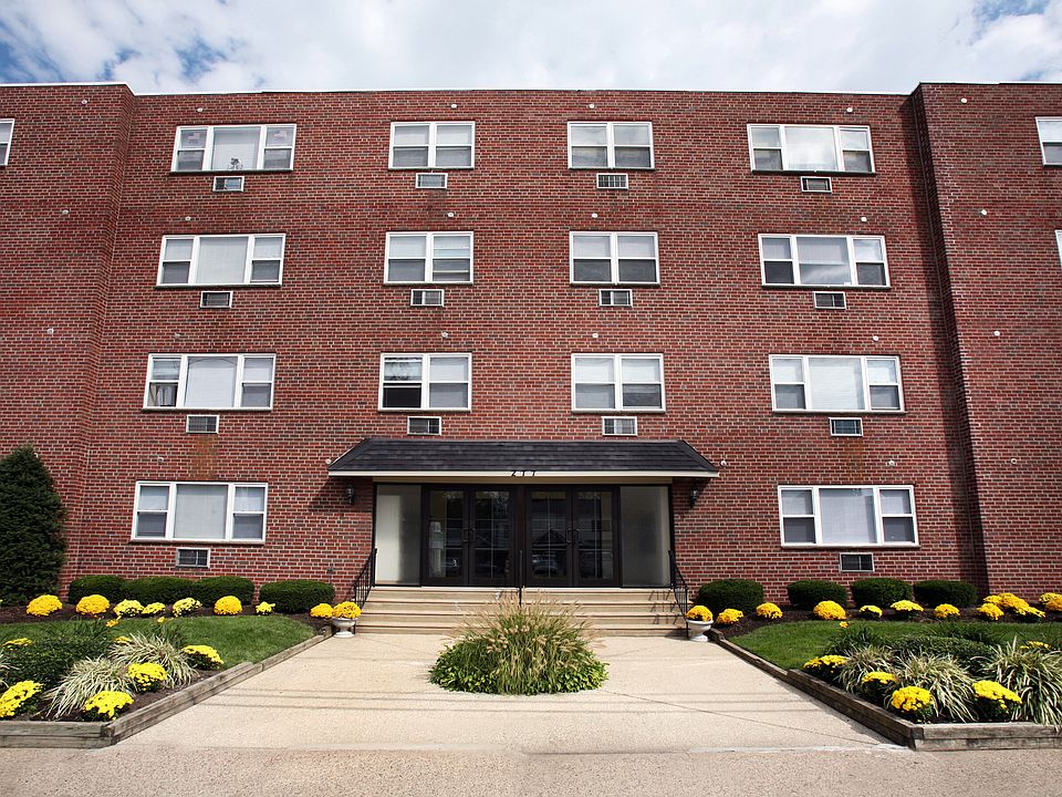 Welcome home to Audubon Arms Apartments_beautifully maintained grounds and a charming brick exterior.
