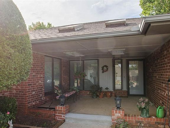 Large covered front porch provides a shady place for plants or people watching.