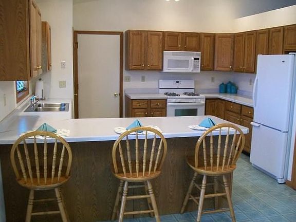 Large open kitchen with breakfast bar and 2 pantries