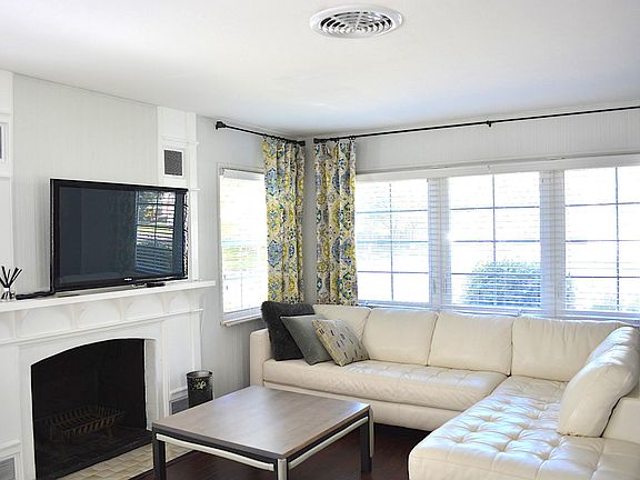 A charming fireplace and windows in every room bring in gorgeous light!