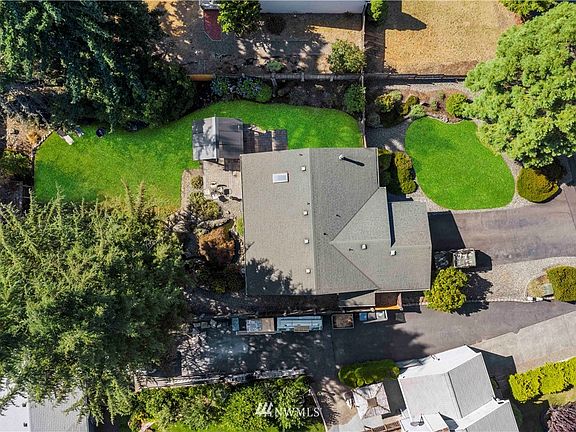 Birds eye view shows yard/lot that has been so well cared for. It includes inground sprinkler system and fully fenced yard has concrete posts so you should never need to replace them. 
