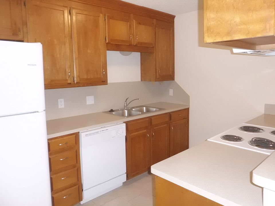 Kitchen with appliances and bar