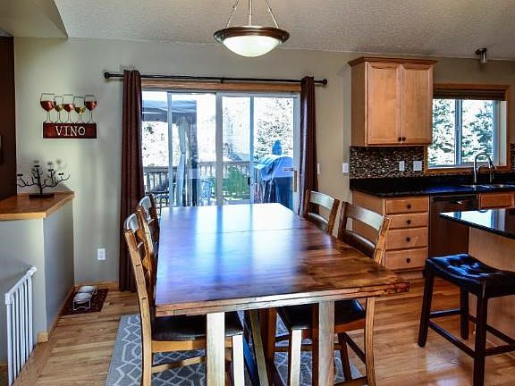 Eat in kitchen with hardwood floors.