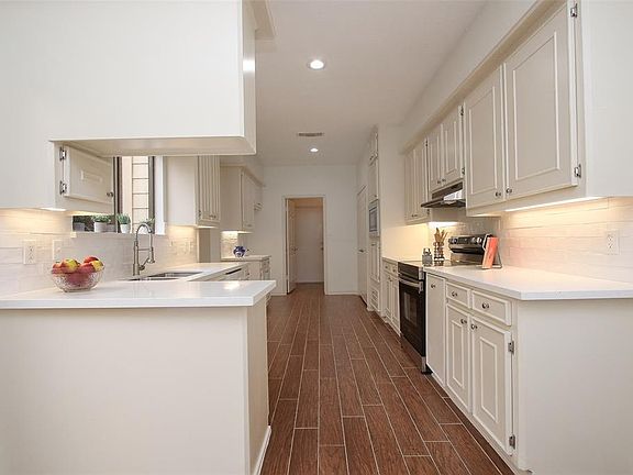 Freshly painted cabinets with new hardware.