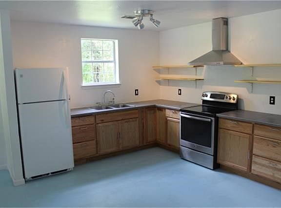 New kitchen cabinets and stove.  Stove, frig and washer and dryer go with home