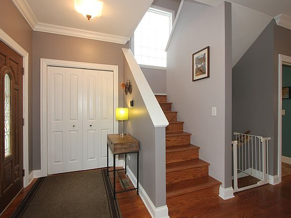 Foyer, stairs to second floor and lower level