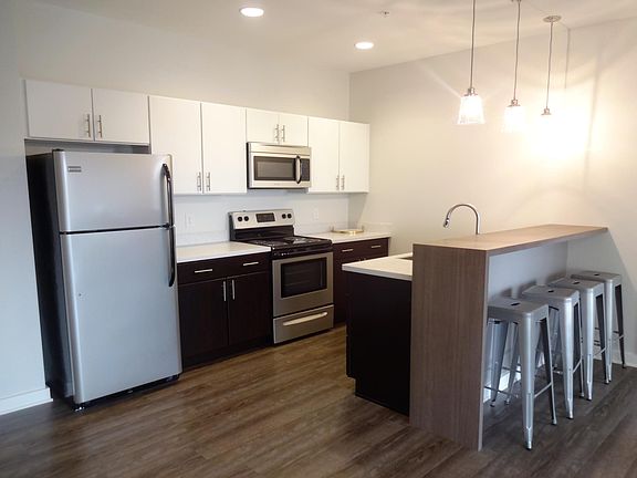 Colfax@Hill Kitchen with stainless appliances including dishwasher and garbage disposal