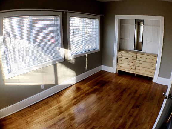Sunny bedroom with beautiful floor and closet