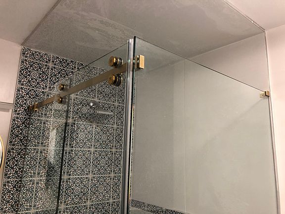 1st floor full bath - 3/8 thick glass shower enclosure with sliding glass door