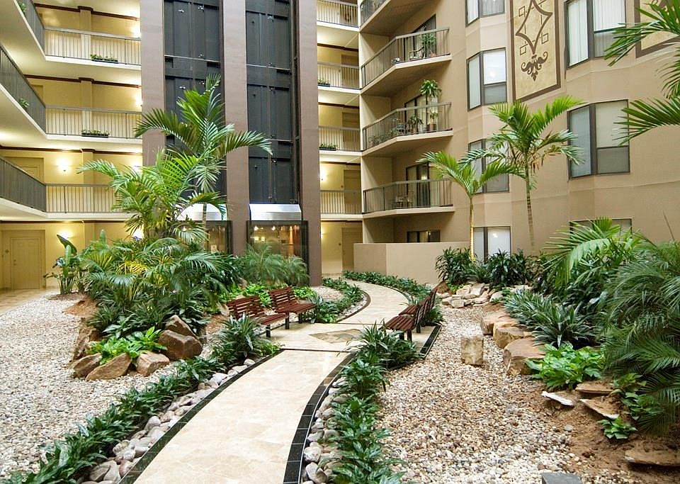 Woodway Place Atrium Condominiums. Beautiful grounds inside and out. Glass-sided elevators.