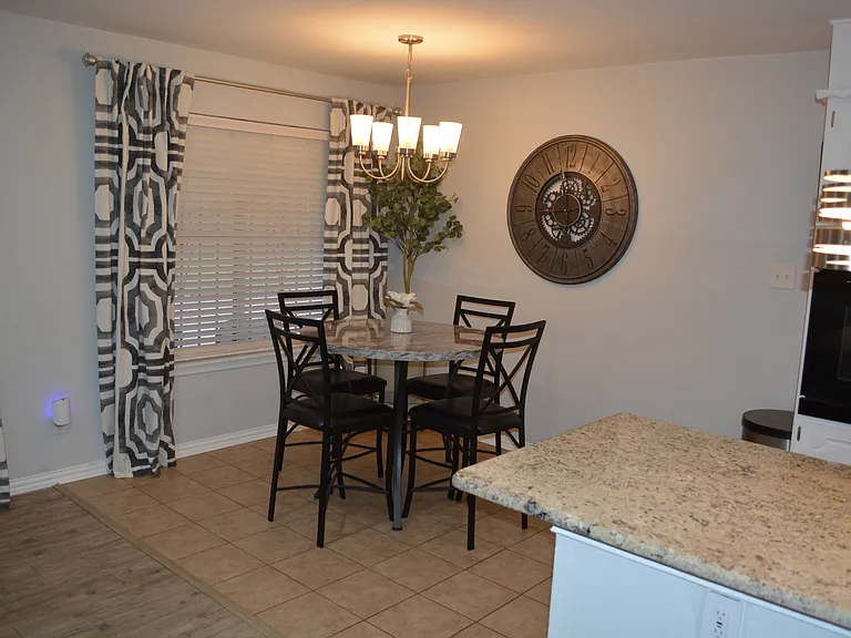 Bright and airy dining room with seating for 4.