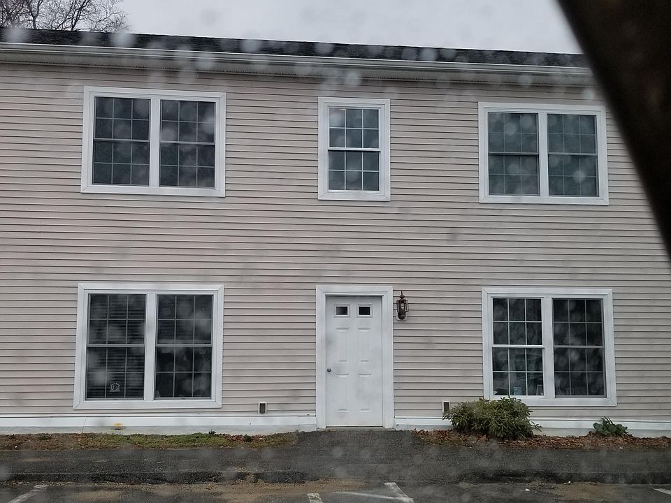 Exterior front, unit is top left from front view.