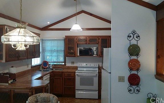 View of kitchen with corner sink.