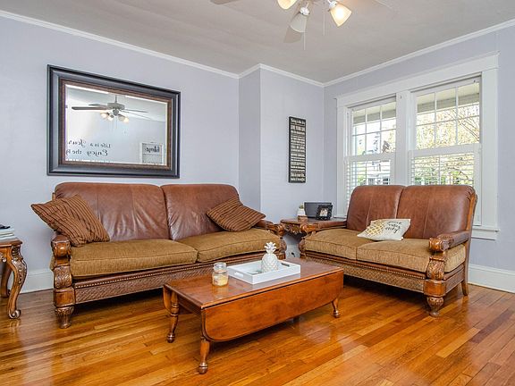 Living Room. Wooden shutters on windows.