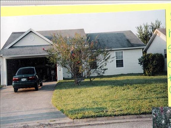 Front - Tree trimmed now, new garage door 2002