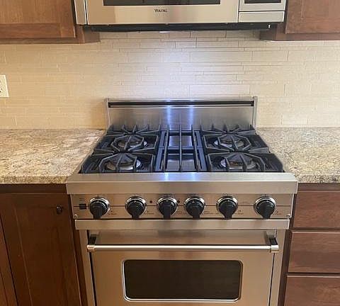 Gas range, microwave, dishwasher and garbage disposal.