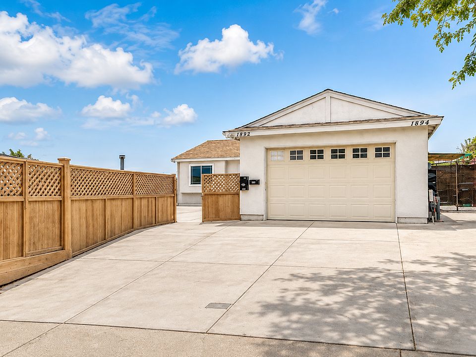 Front with 3 card drive way parking