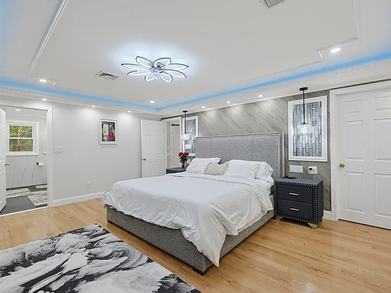 Main Bedroom with Custom Built ins and lighting