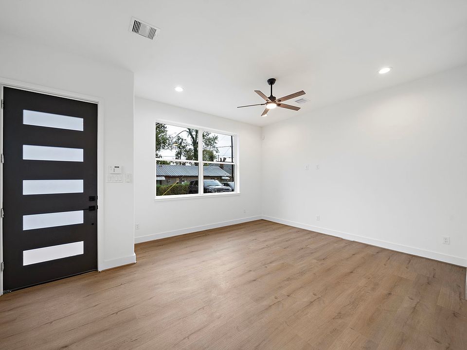 Front door featuring the security pad and living room