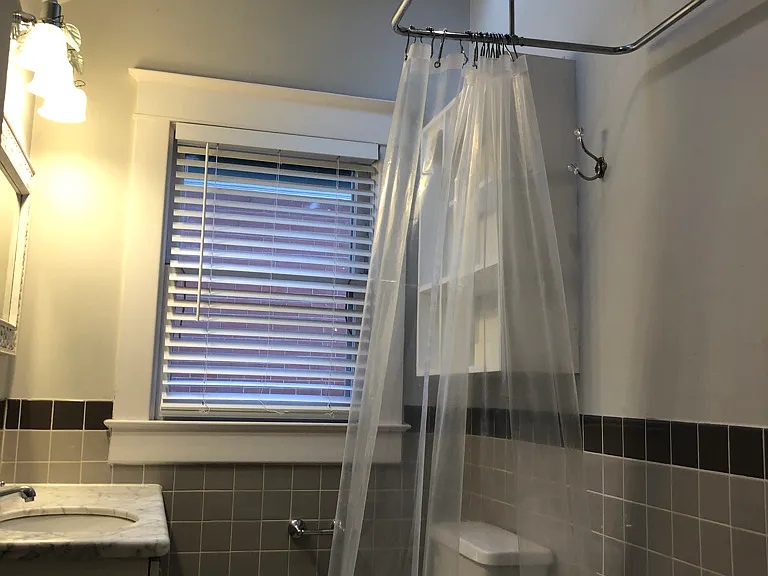 Second floor bath with vaulted ceiling and skylight