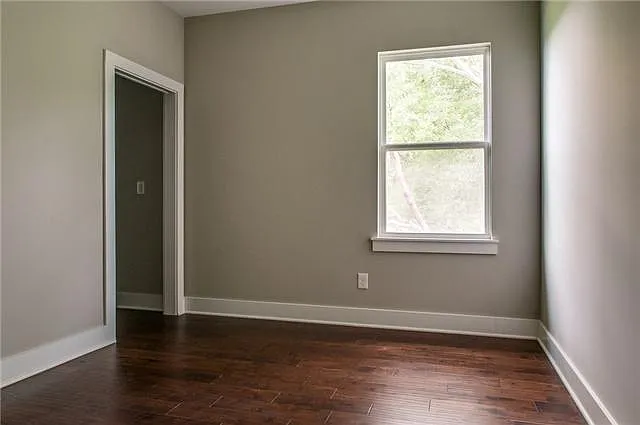 second bedroom, custom blinds (not pictured) and a walk in closet