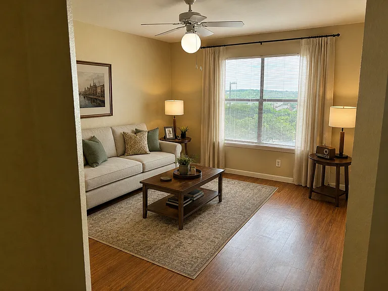 Living room featuring hardwood floors, ceiling fan with light and large windows.